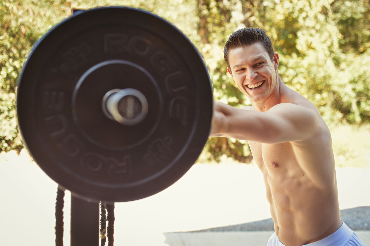 Andrew Dettelbach Lifting a barbell smiling