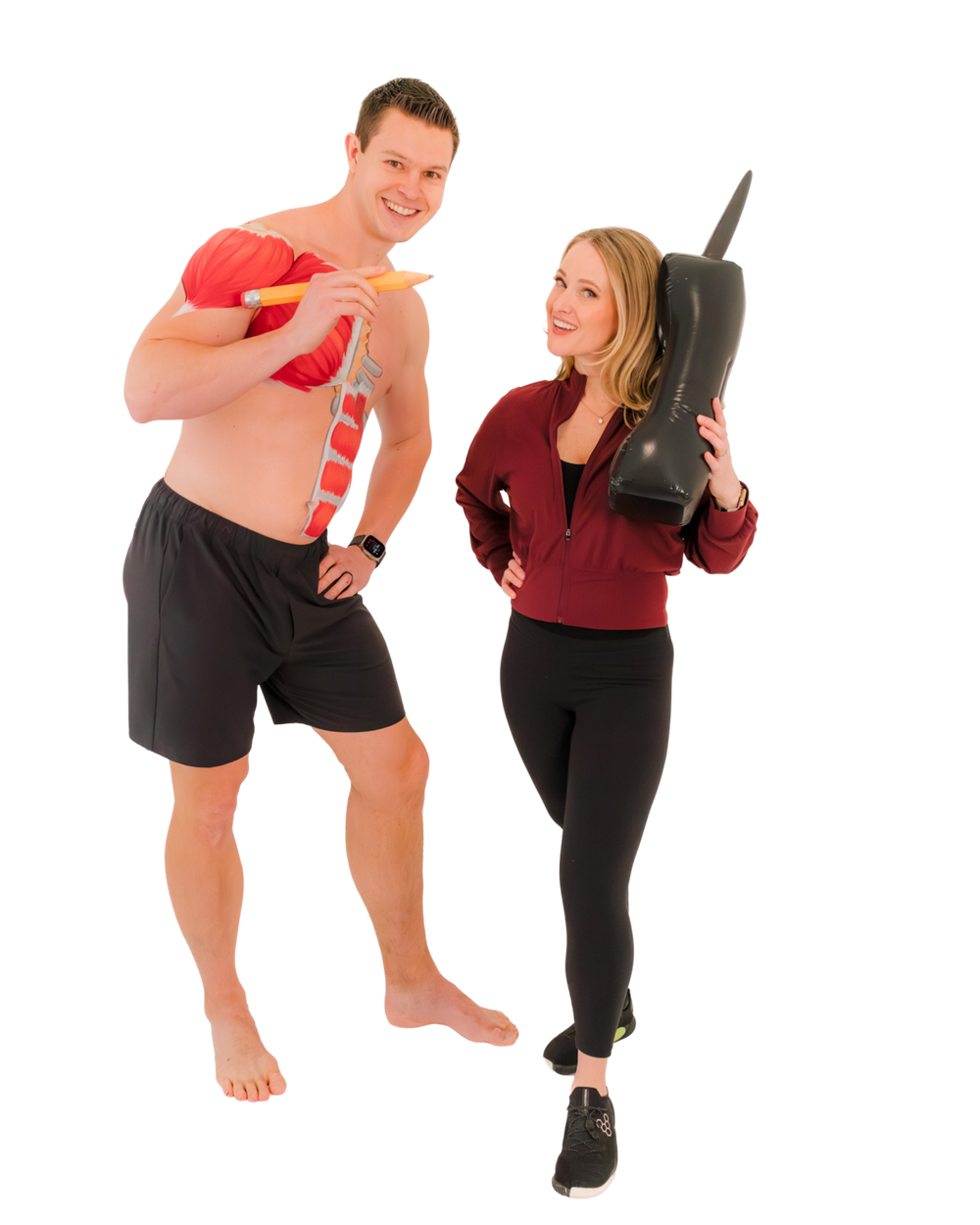 Two Whealth educators holding anatomical teaching models (oversized pencil and phone)